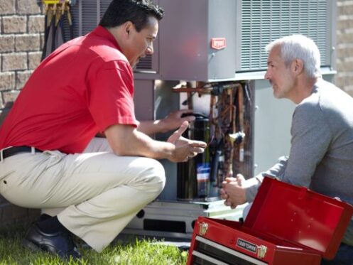 HVAC Technician Explaining HVAC Repair to Customer in Orlando, FL